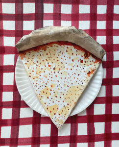 slice of pizza on paper plate